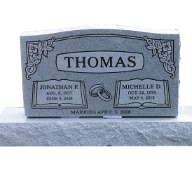 Gray double headstone with last name Thomas