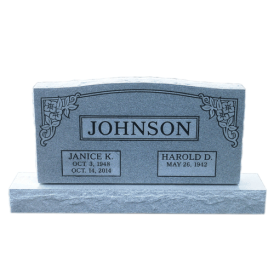 Gray double headstone with last name Johnson