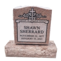 Red headstone with cross and name Shawn Sherrard
